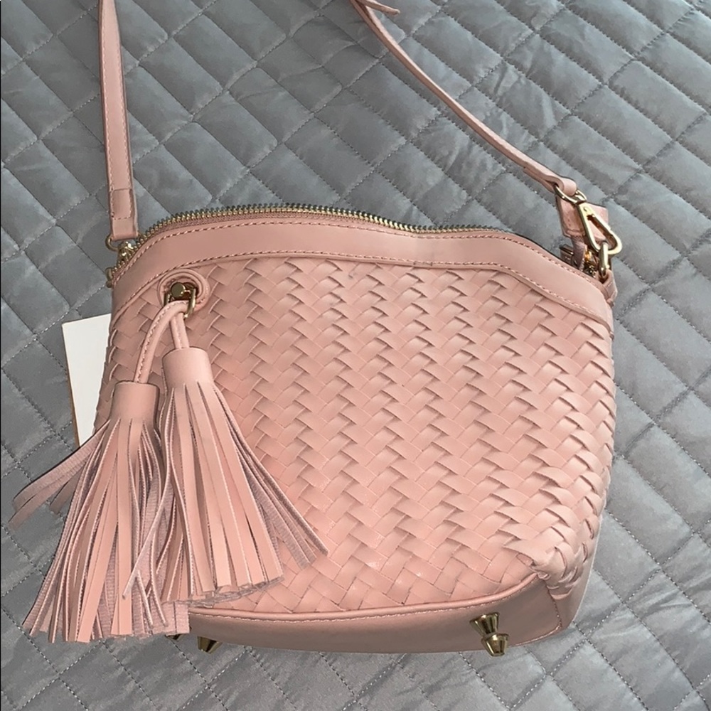 Pink side bag with tags